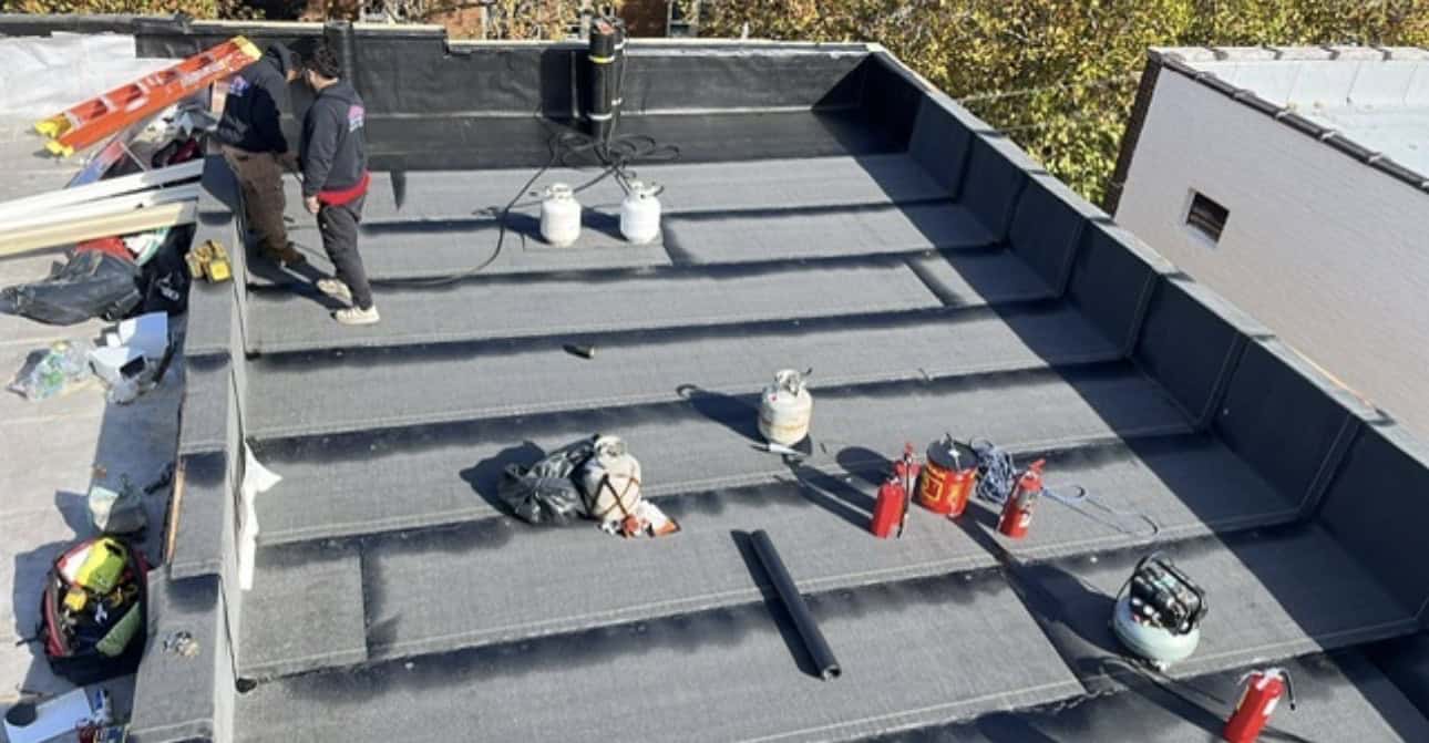 Flat roof with NYC skyline view across the Hudson — Gaby Roofing project, Hudson County NJ