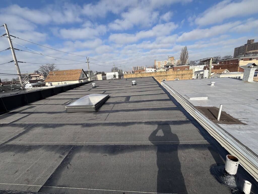 Aerial view of a roofing project in Weehawken NJ by Gaby Roofing flat roof specialist crew