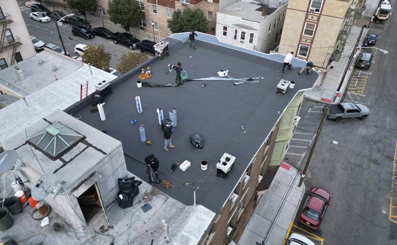 Gaby Roofing crew installing torch-down modified bitumen on a commercial flat roof in Hudson County NJ