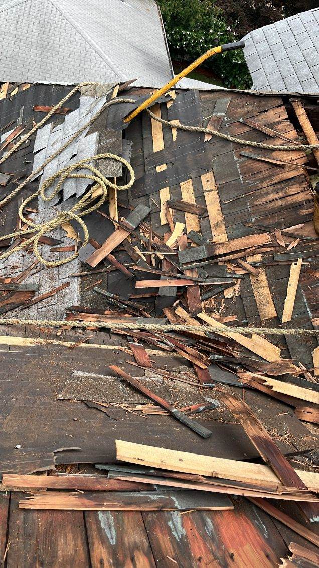 Shingle roof tear-off showing old roofing removal by Gaby Roofing crew in New Jersey