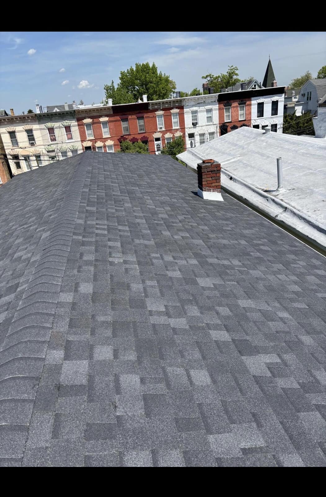 Architectural shingle roof replacement on a Jersey City NJ row home with adjacent flat roof — Gaby Roofing flat roof specialist