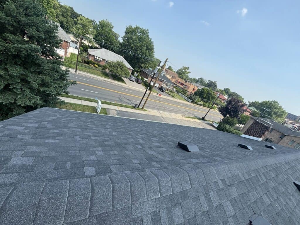 New architectural shingle roof with ridge cap and roof vents installed in Bergen County, NJ