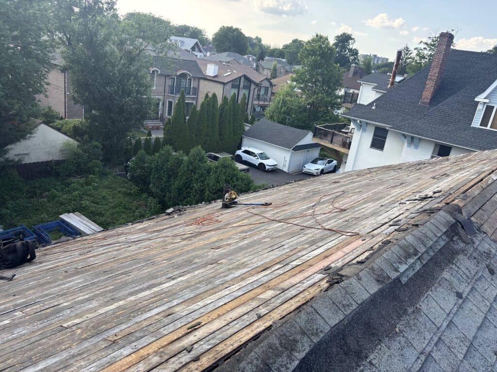 Shingle roof tear-off down to the original plank decking in Bergen County, NJ