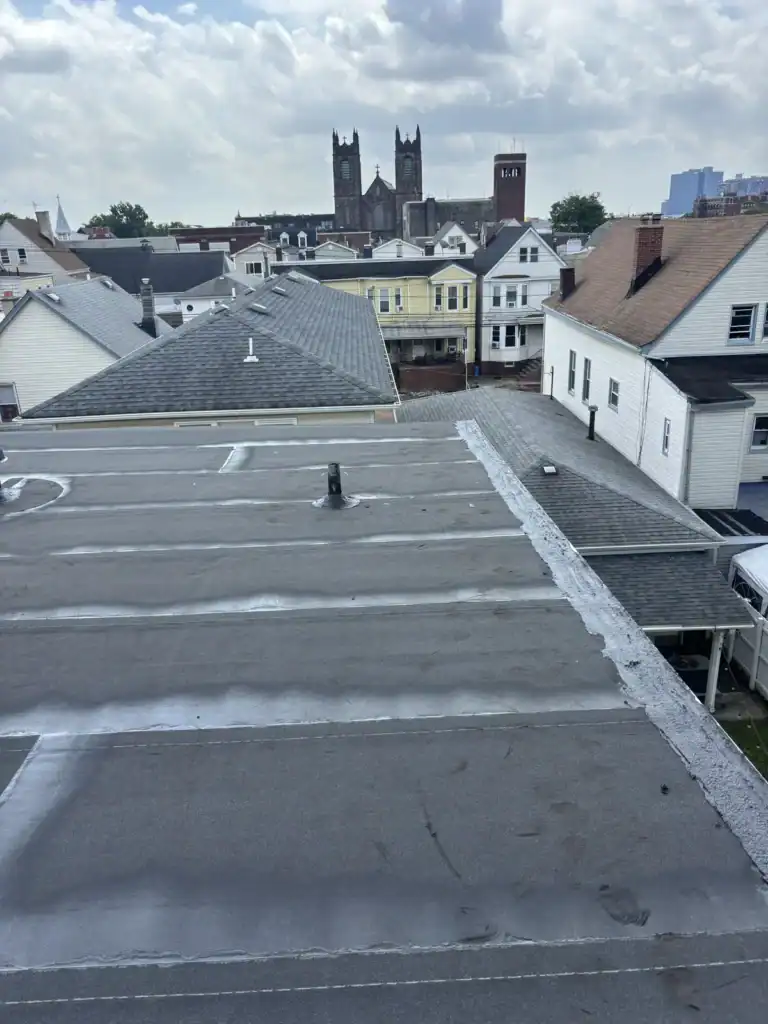 Completed torch down flat roof replacement on a multi-family rowhome in Harrison NJ by Gaby Roofing
