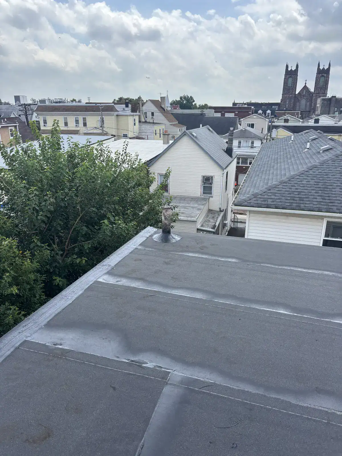 New flat roof edge metal and drip edge on a Harrison NJ home
