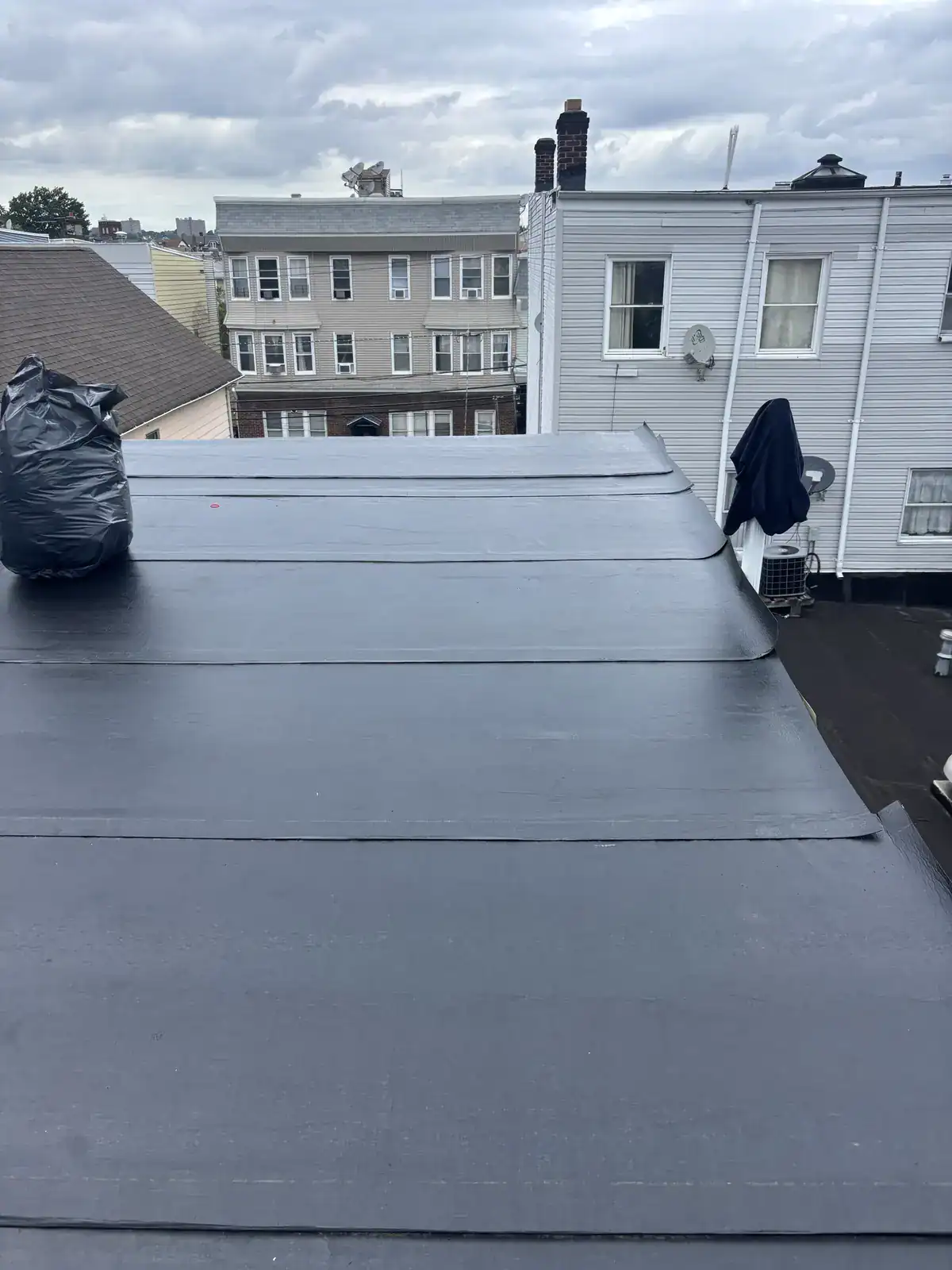 Torch down base sheet installed over the new roof deck in Harrison NJ
